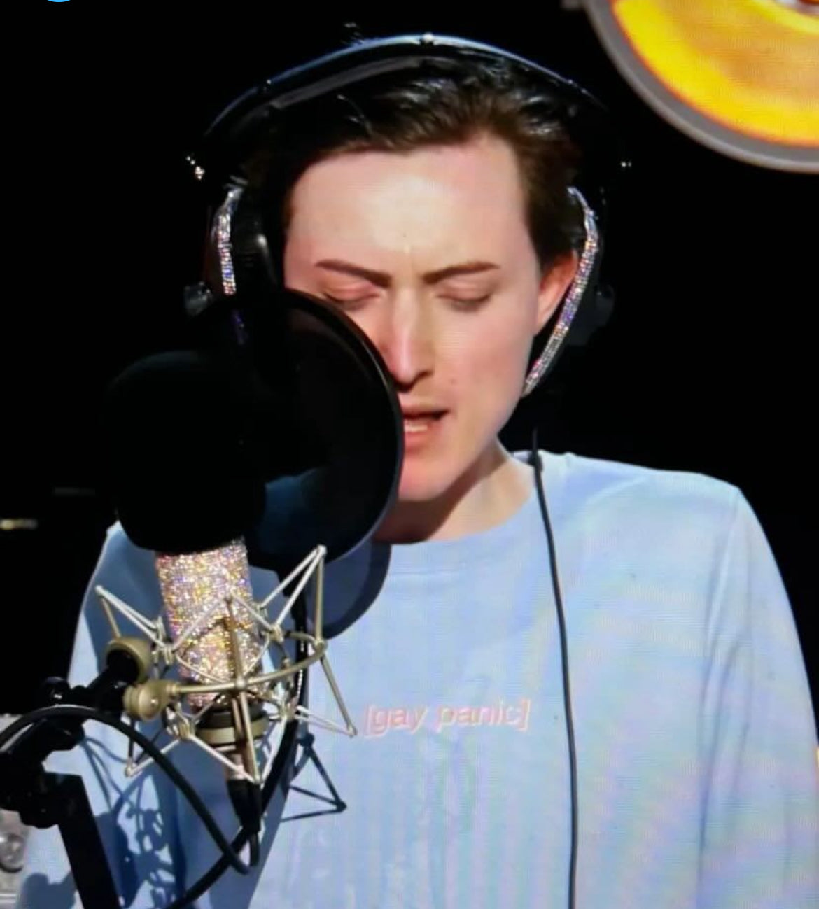 Marmalade on drag race recording a song whilst wearing the "[gay panic]" jumper