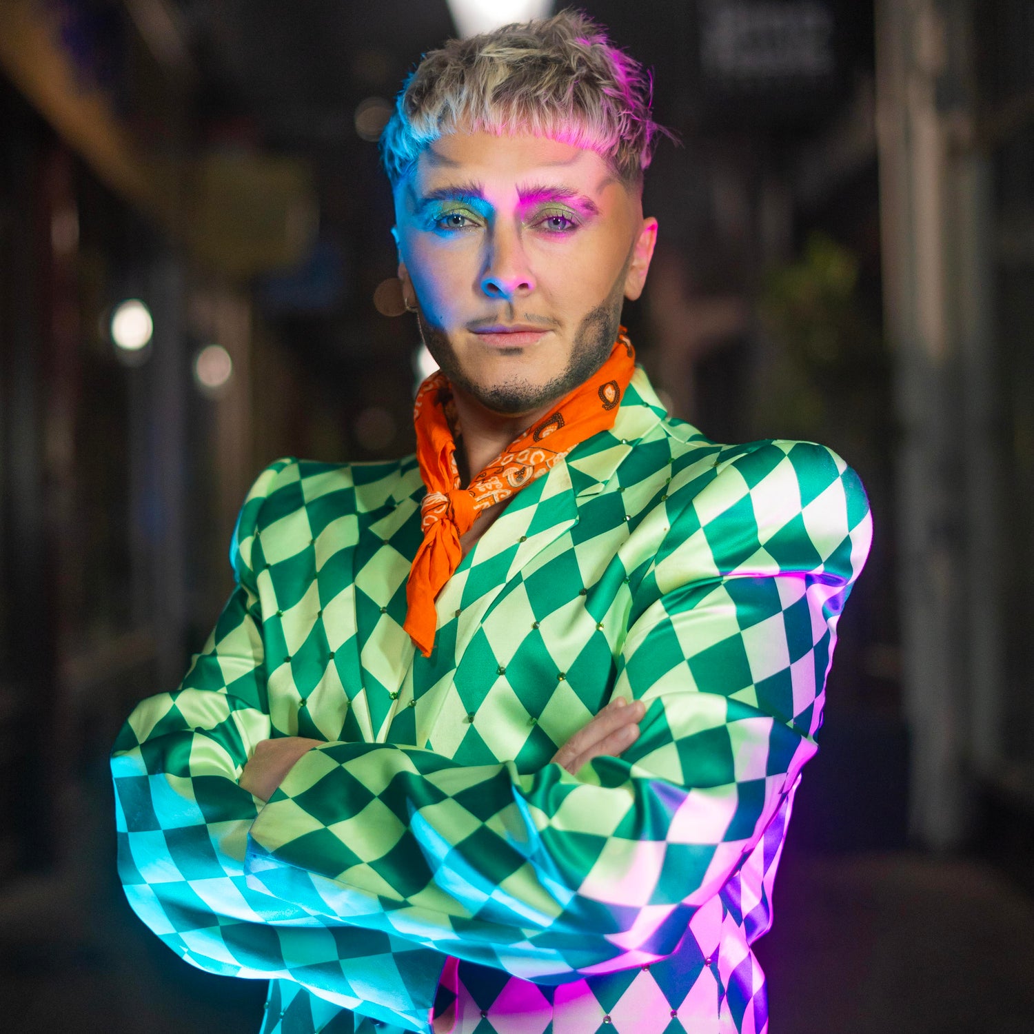 Justin Drag stares directly at the camera, with the Royal Arcade blurred behind him.
